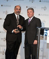 dennis-najjar-accepts-gold-stevie-award-accounting-department